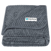 PetAmi waterproof dog blanket on a couch protects furniture from spills.