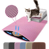 Petinstinct extra-large cat litter mat in front of the box catching stray litter.