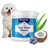 Petpost Tear Stain Wipes on a dog's face for gentle stain removal.