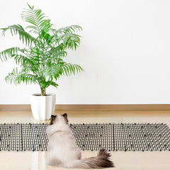 Pomeat Cat Scat Mat used on sofa to prevent scratching