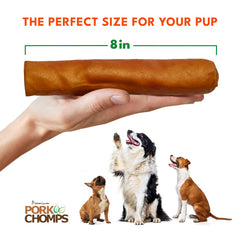 Dog enjoying a Pork Chomps roll during a chewing session.