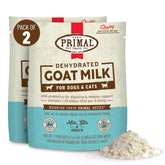 Primal Goat Milk Powder topper being stirred in warm water for hydration.
