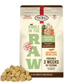 Primal Kibble in The Raw bag showing freeze-dried chicken for lean muscle support.