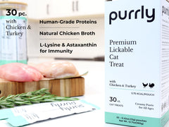 Purrly interactive lickable treats with turkey breast pouch, rich flavor for feline appeal.
