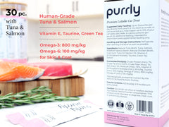 Purrly Squeezable Treats cat enjoying creamy texture and aroma.