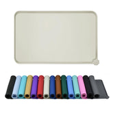 Reopet waterproof pet feeding mat laid flat for a spill-free dining area.