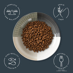 Reveal dry kitten food kibble closeup highlights grain-free recipe and natural ingredients.