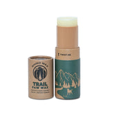 Rhino Wax Trail Wax bottle guarding dog paws on rugged trails.