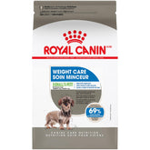 ROYAL CANIN X-Small Weight Care kibble in a bowl supports fullness and gentle weight management for small dogs.