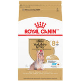 Royal Canin Yorkshire Terrier 8+ kibble close-up with small, easy-to-chew pieces for seniors.
