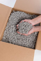Small Pet Select bedding in a rabbit cage illustrating odor control.