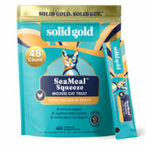 Solid Gold SeaMeal Squeeze chicken treat bottle highlights convenient, lickable feeding.