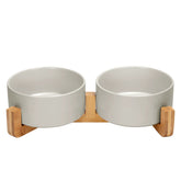 SPUNKYJUNKY ceramic bowl with wood stand promotes tidy meals
