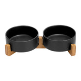 SPUNKYJUNKY ceramic bowls on wooden stand reduce spills and keep floors clean.