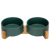 SPUNKYJUNKY ceramic dog and cat bowl on wood stand for elevated feeding.