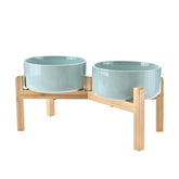 SPUNKYJUNKY elevated ceramic dog bowl with bamboo stand promotes comfortable posture.