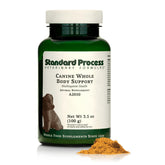 Standard Process Canine Whole Body Support powder in a dog bowl for daily multisystem nourishment.