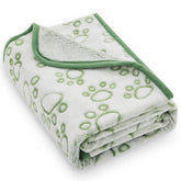 Stuffed pink dog blanket with paw print top for cozy naps