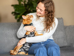 Suitical Recovery Suit for Cat highlights chest area for secure protection.