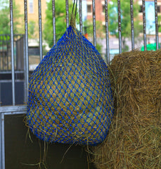 T TEKE Ultra Slow Hay Feeder Net in stable use for horses and goats.