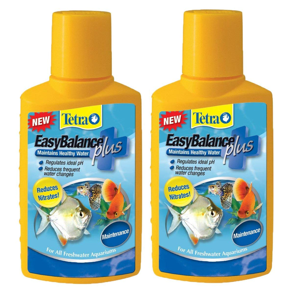 Tetra EasyBalance Plus bottle being poured to stabilize aquarium water quality.