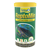 Tetra ReptoMin floating food sticks being poured from the bottle for convenient feeding.