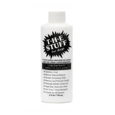The Stuff Leave-In Dog Conditioner bottle pour supports easy mixing and application.
