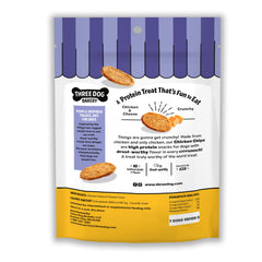 Three Dog Bakery Bark'N Crunch bag open with chips spilled, signaling protein-rich, grain-free snacking.