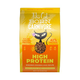 Tiki Cat Born Carnivore kibble with real chicken and egg in a serving bowl, protein-rich meal.