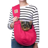 TOMKAS rose red dog sling with front pocket for essentials and secure transport.