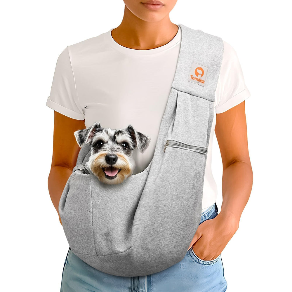 Tomkas small dog sling carrier front view showing the grey design and roomy opening for comfort on walks.