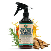 Trail Guard spray bottle in hand ready for outdoor pet protection.