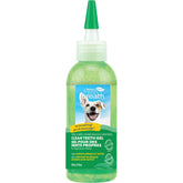 TropiClean Fresh Breath toothpaste applied to dog's teeth for fresher breath.