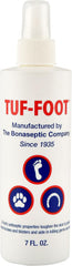 TUF-FOOT bottle shown ready to protect a dog's paw from hot pavement.