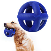 Tuff Pupper SuperChewer cage ball toy blue seen in grass for enhanced visibility during play