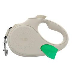 TUG Oval 360 retractable leash in cream offers smooth, tangle-free control for dogs up to 33 lbs.