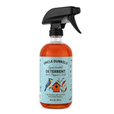 Uncle Dunkels spicy pepper deterrent bottle label shows all-natural solution for outdoor use.