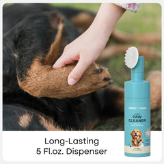 Uproot Clean paw cleaner in action scrubbing dog paws for a quick cleanup.