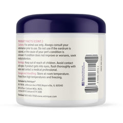 Dog ears being wiped during grooming with Vetnique Oticbliss.