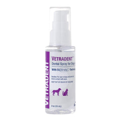 Applying Vetradent Dental Spray to a pet’s mouth for tartar control