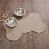VHC Brands bone-shaped rug in natural tones protects floors from spills indoors or outdoors.
