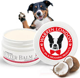 Warren London Hydrating Butter Balm applied to a dog's paw for deep moisture after walking.