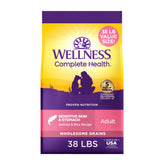 Wellness Complete Health dog food bag front shows salmon and rice recipe for sensitive skin