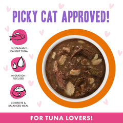 Close-up of gravy and tuna-salmon chunks in Weruva OMG pouch for flavor.