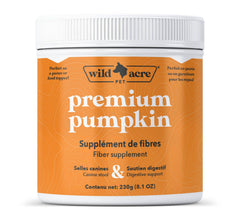 Wild Acre pumpkin powder bottle beside a dog's meal, supports digestion.