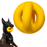WoofBite indestructible ball in bright yellow for aggressive chewers and fetch.