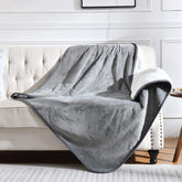 Yaning waterproof blanket on bed and couch protecting furniture from spills and fur.