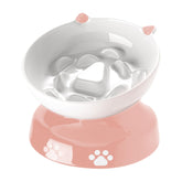 YYHY ceramic slow-feeder cat bowl with tilted pink design for paced meals.