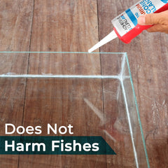 Clear aquarium sealant forming a seal around decorations on the tank wall