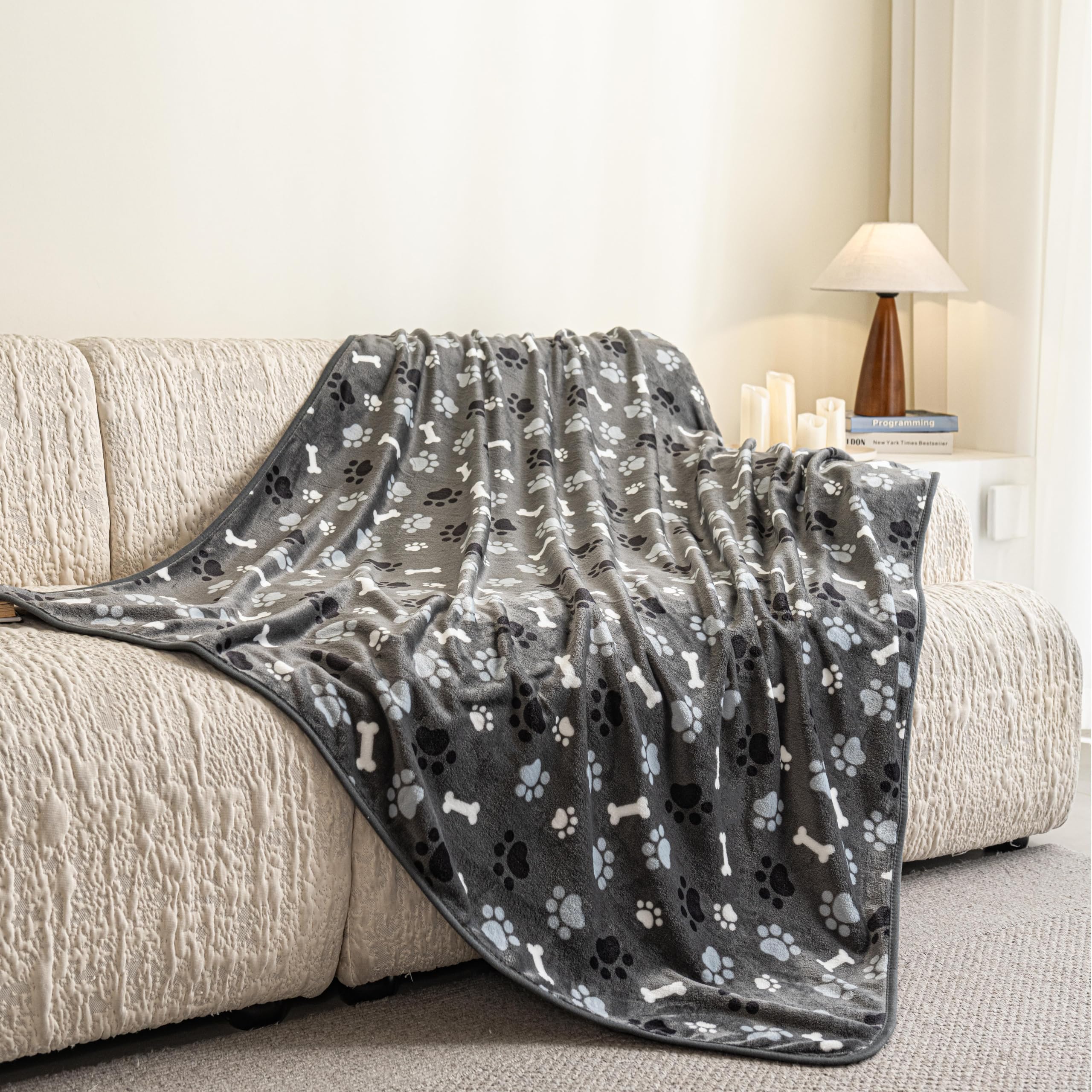 AIWEK pet blanket on sofa protects against hair and scratches.